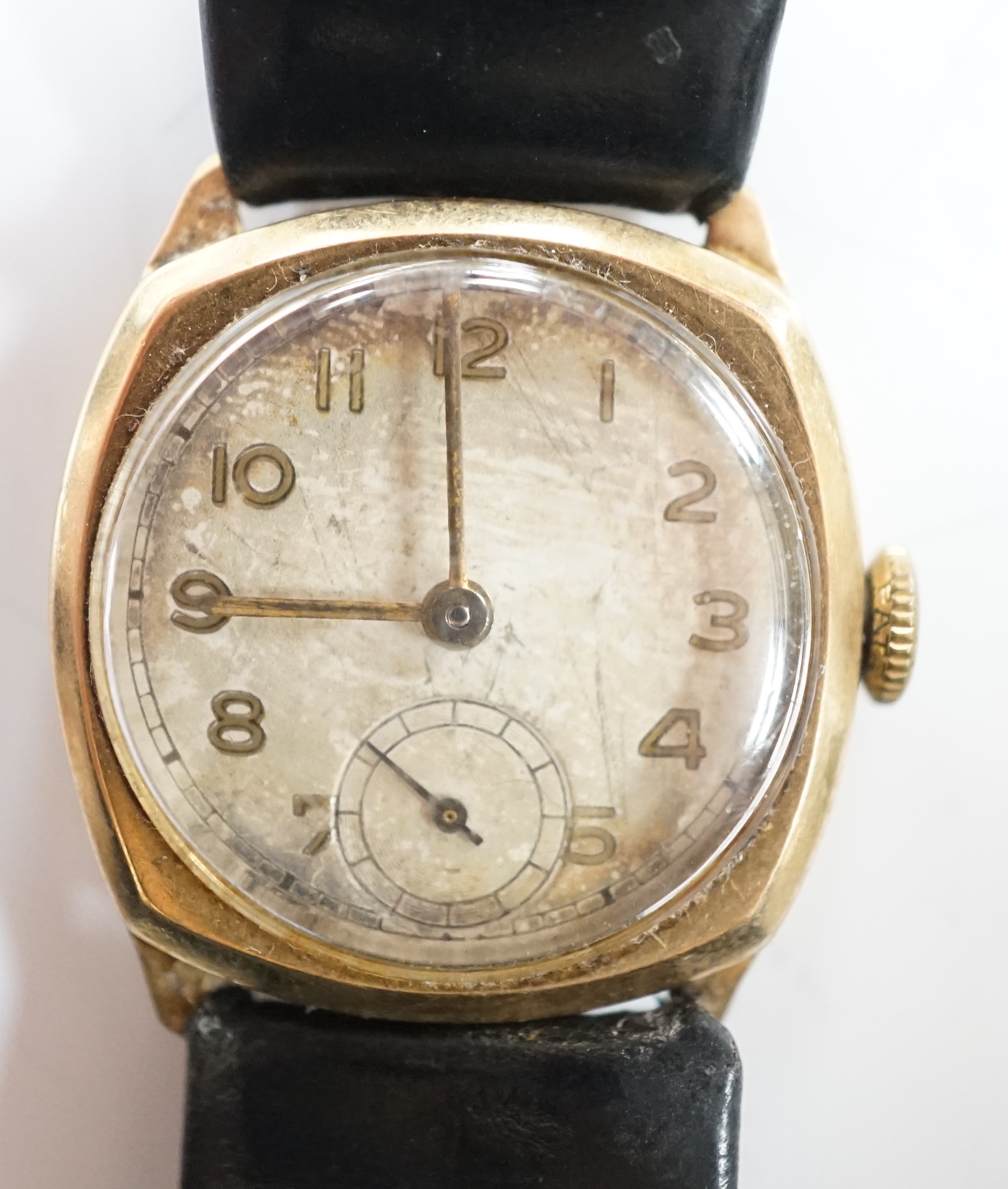 A gentleman's early to mid 20th century 9ct gold manual wind wrist watch, with subsidiary seconds, on a leather strap.